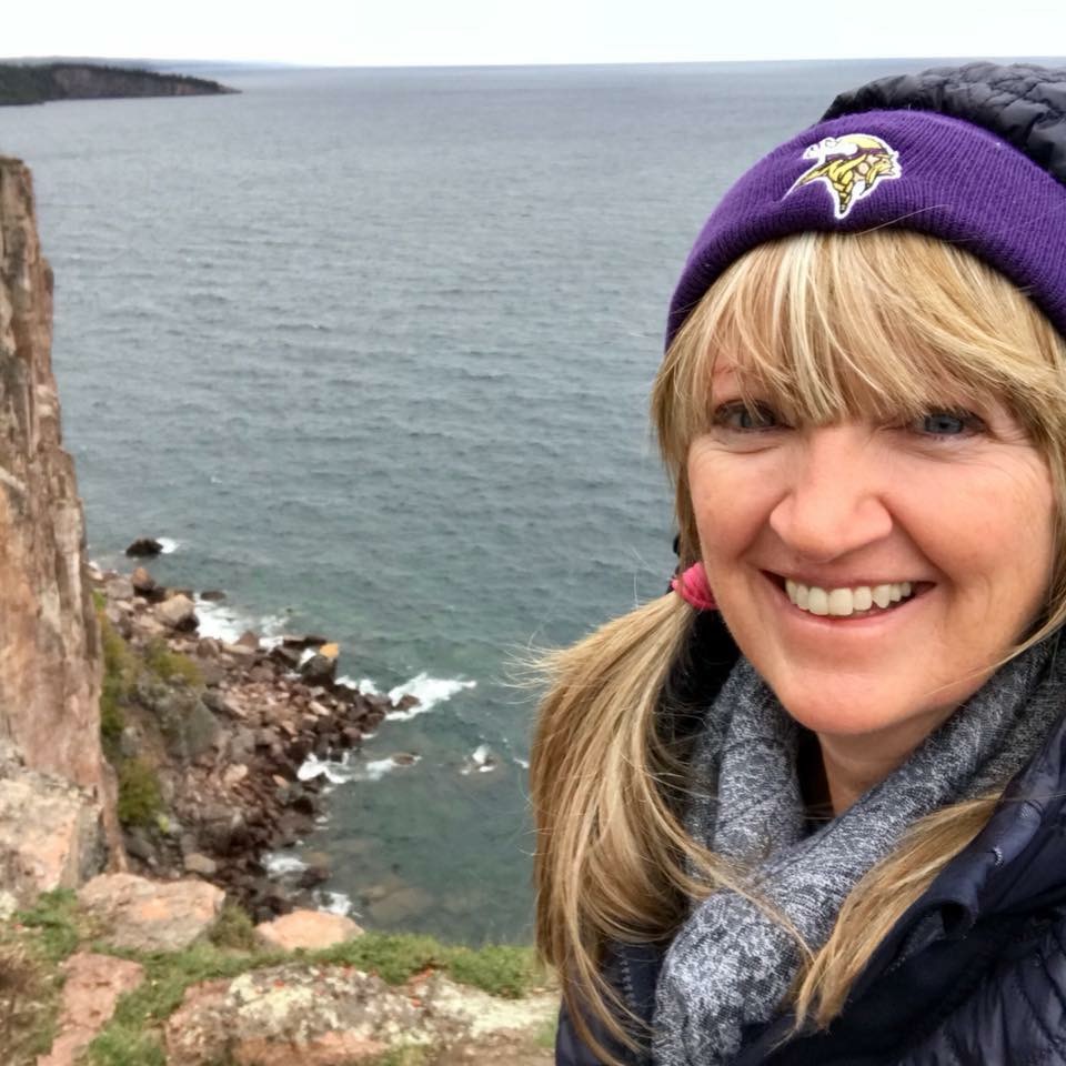 North Shore, Minnesota selfie of a woman on a cliff overlooking a lake