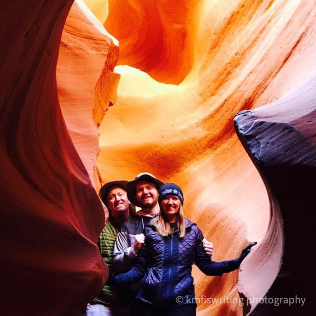 Family of three, man, teenager and woman, at Lower Antelope Canyon