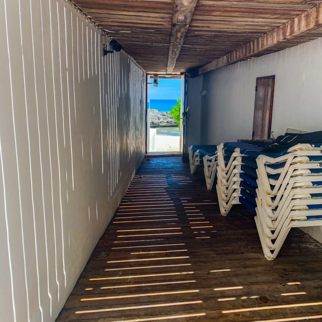 Hallway leading to an open door overlooking a beach