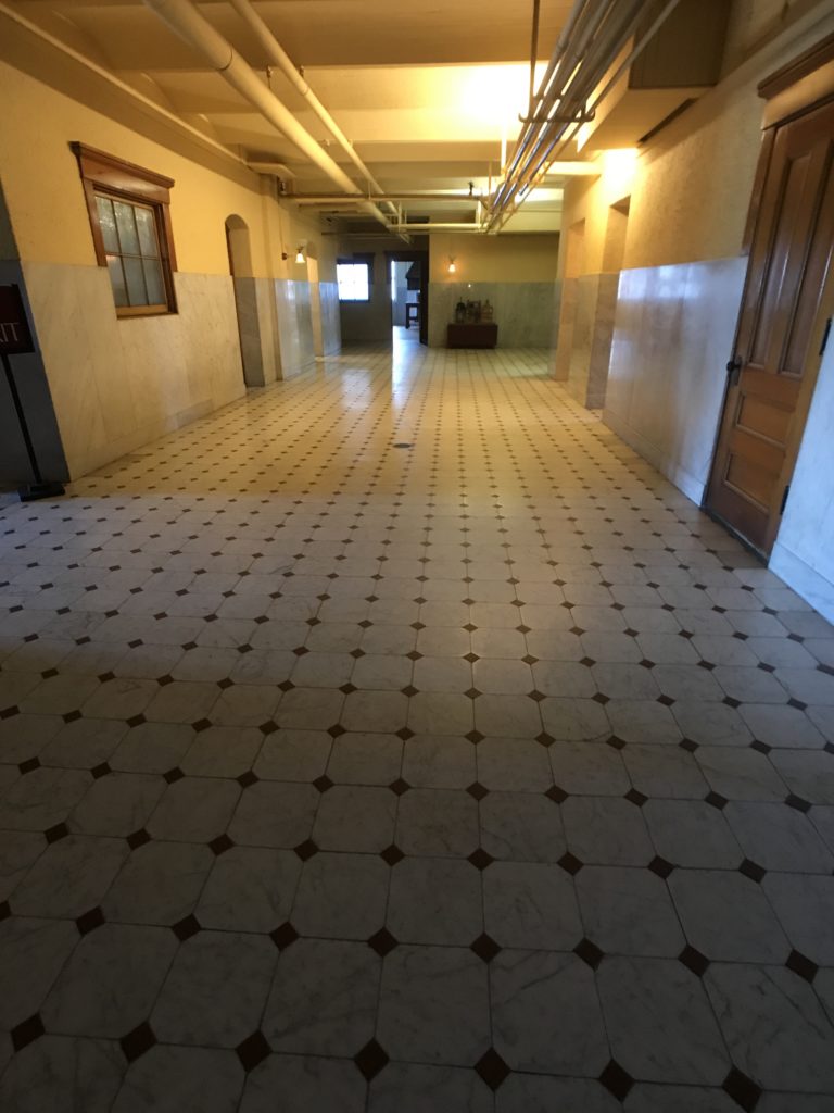 Wide hallway with inlaid marble floor at the James J. Hill House in St. Paul, Minnesota.