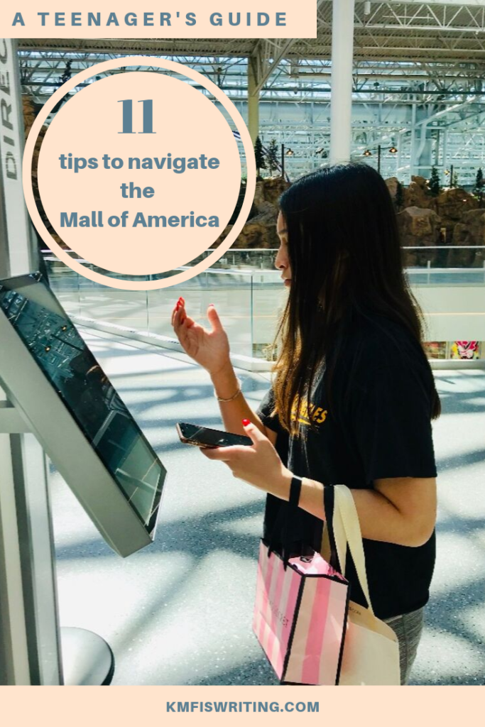 Teenager girl looking up directions at Mall of America  