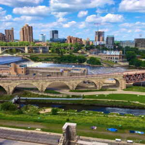 View of Stone Arch Bridge, St. Anthony Falls, and Mississippi River from Mill City Museum rooftop in Minneapolis