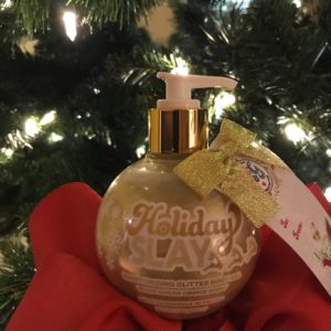 sunscreen in a gold Christmas ornament bottle 