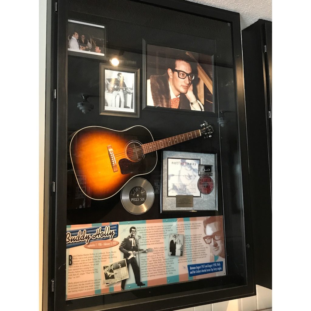 Buddy Holly display of pictures and guitar in Buddy Holly Museum in the Surf Ballroom in Clear Lake, Iowa 