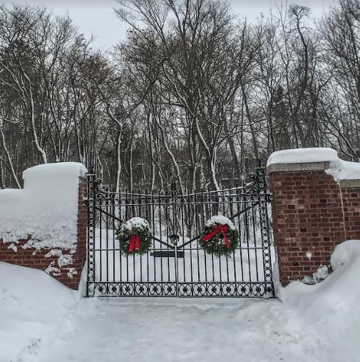 Glensheen Mansion Gates with Christmas wreaths and snow 