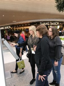 Women shopping at Mall of America looking for directions