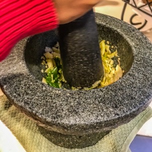 Mortar and pestle with garlic for authentic pad Thai meal