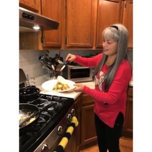 Woman making authentic pad Thai dinner