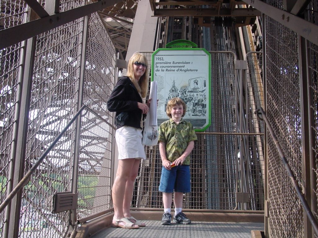 Woman and boy on the Eiffel Tower steps