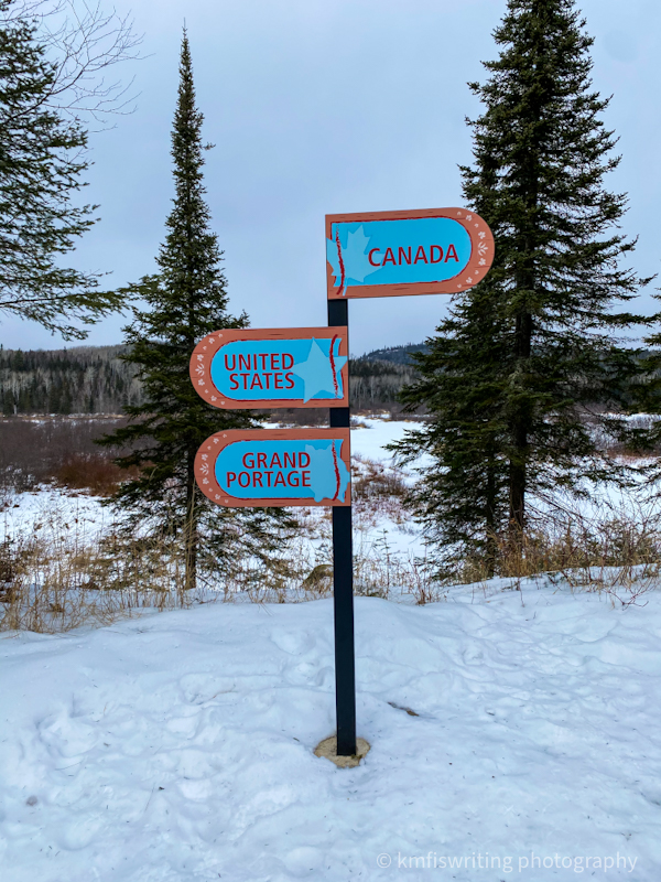 Sign marking Canada, United States, Grand Portage