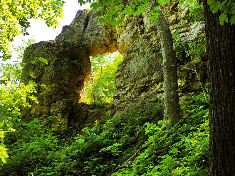 Rock formation with hole in the middle in the forest