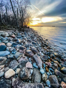 Rocky shoreline of Mille Lacs with a sunset
