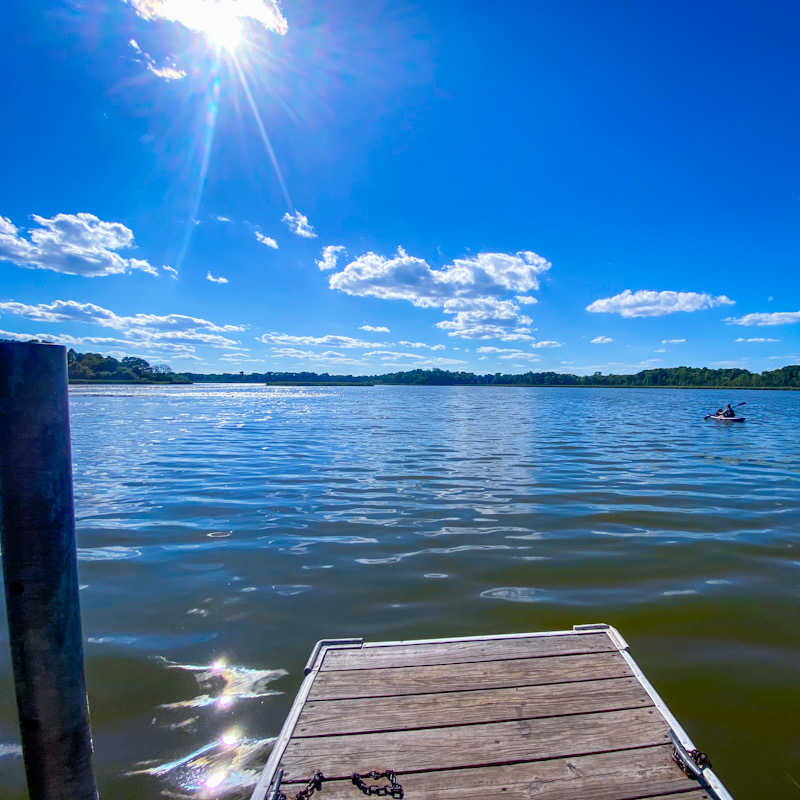 Blue sky, blue lake with kayaker
