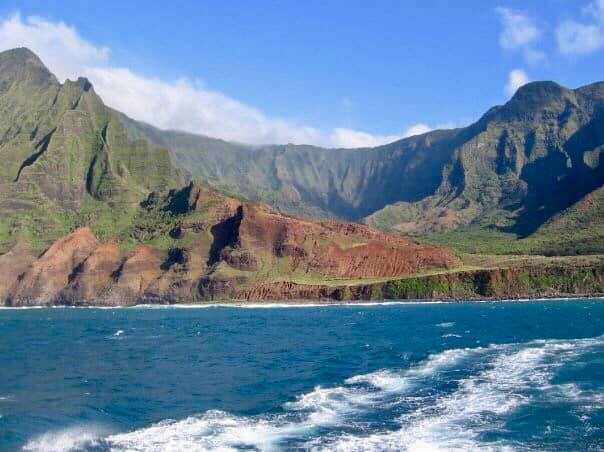 Napali Coast; blue water and colorful cliffs