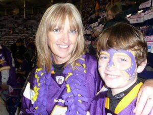 Mom and son with painted face at Minnesota Vikings game