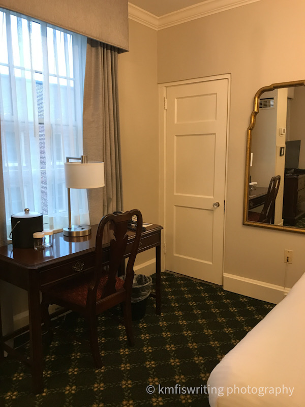 Hotel desk, chair, lamp, mirror, closet door