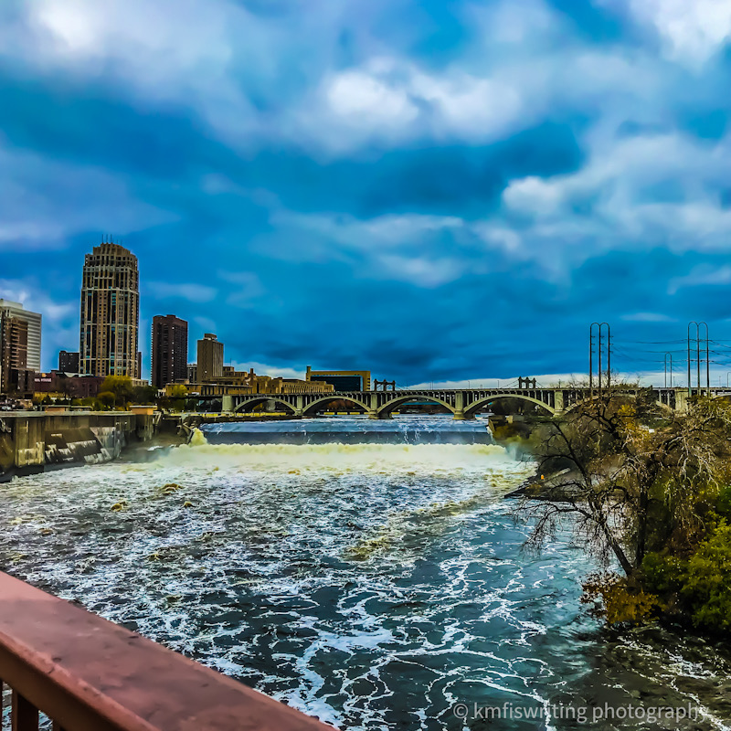waterfall on Mississippi River with blue sky and clouds