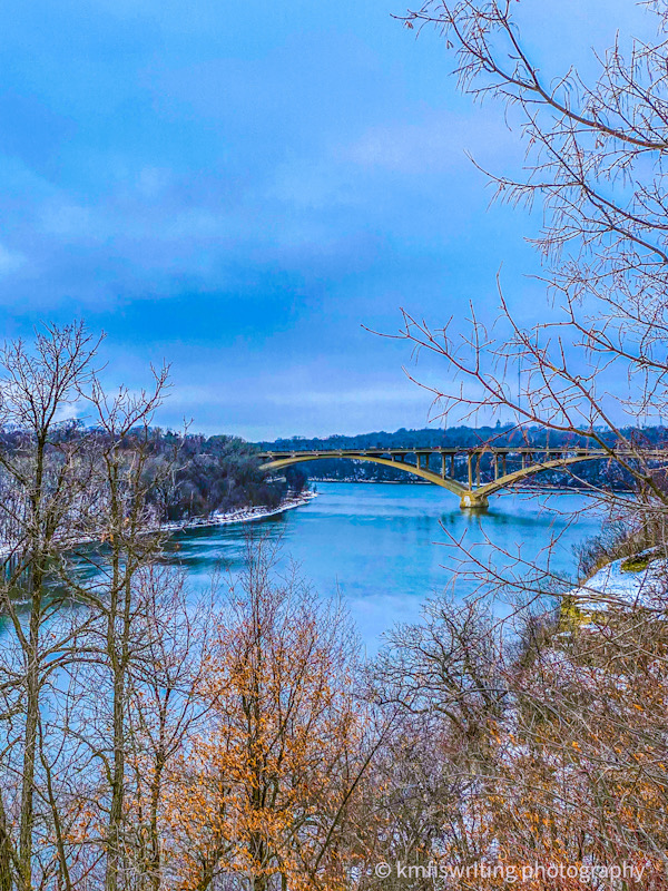 Overlook view of river and bridge in the winter
