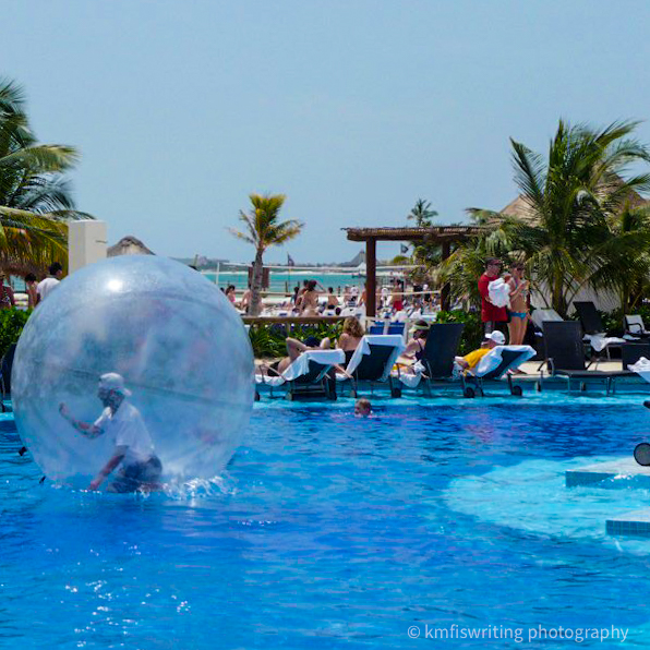 Man in a ball in pool in Mexico