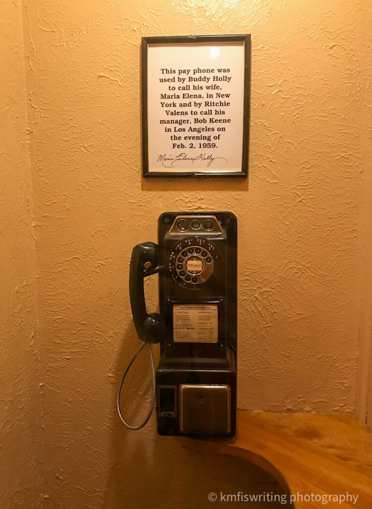 Old-fashioned phone on the wall with rotary dial