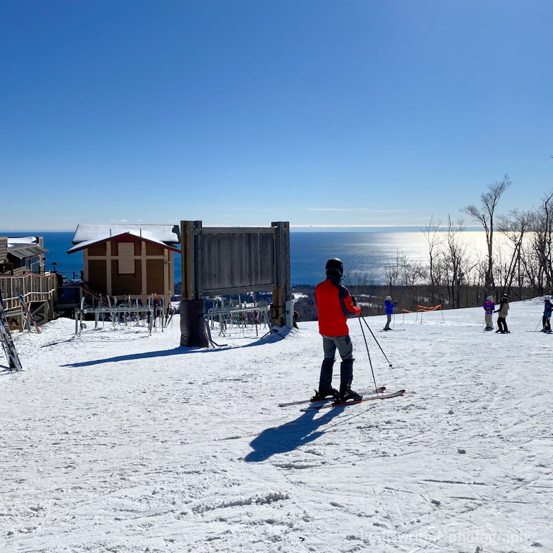 View of Lake Superior from Lutsen Mountains with skiers at ski resort