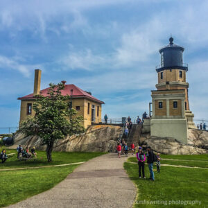 Split Rock Lighthouse with people on the grounds