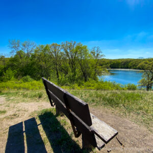 Park bench view of Signalness (Mountain) Lake at Glacial Lakes State Park