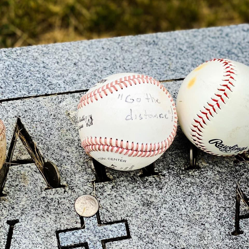 Go the distance Archibald Doc Graham baseball on headstone in Minnesota cemetery