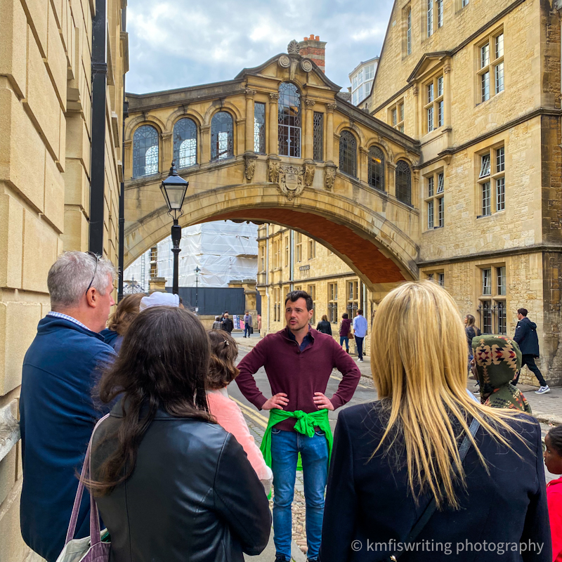 Oxford alumni tour guide walking near Bridge of Sighs