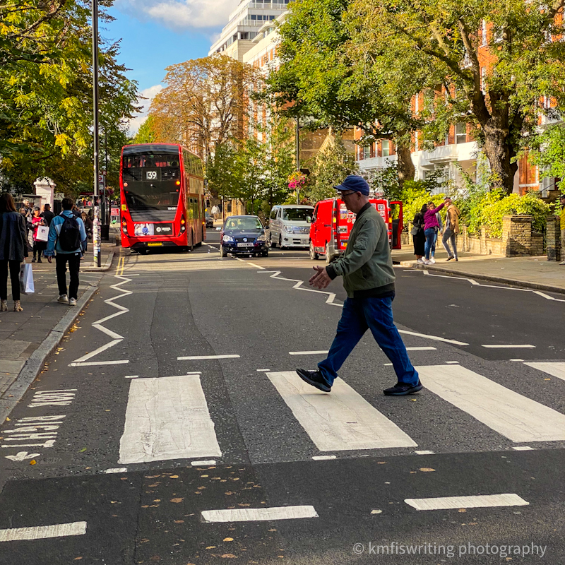 Man crossing Abbey Road Crossing The Beatles in London