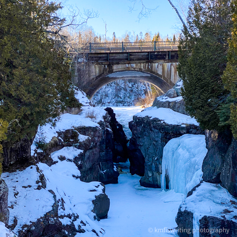 Scenic winter hiking and frozen waterfall views at Temperance River State Park in Minnesota